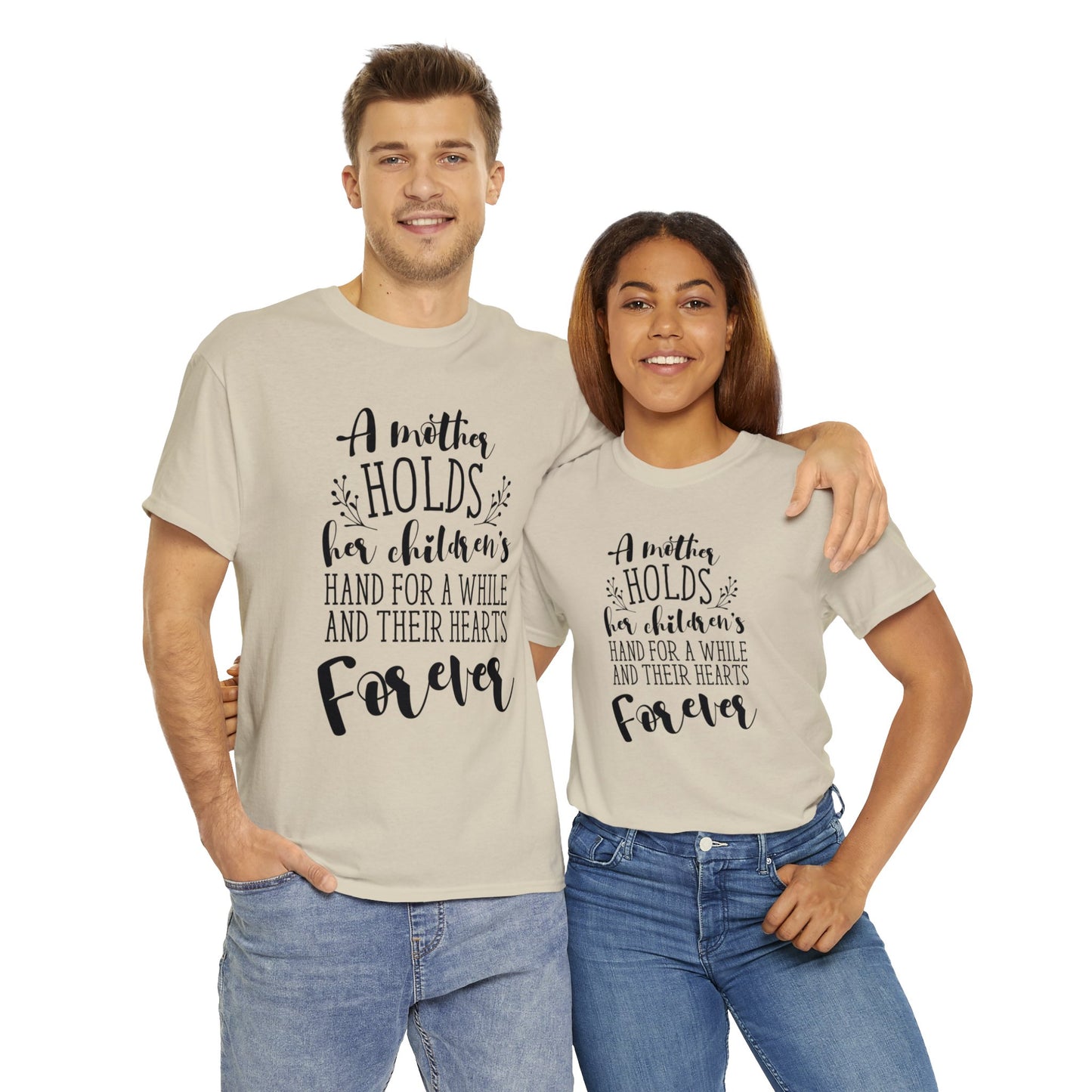 A mother holds her child's heart- Unisex Heavy Cotton Tee