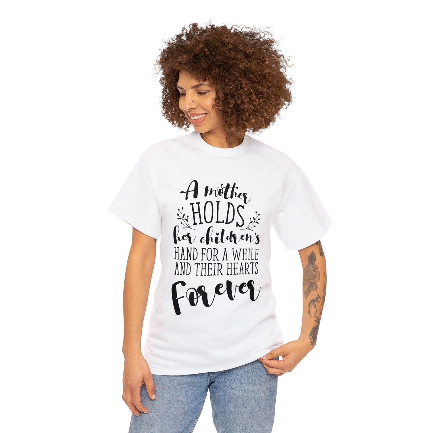 A mother holds her child's heart- Unisex Heavy Cotton Tee