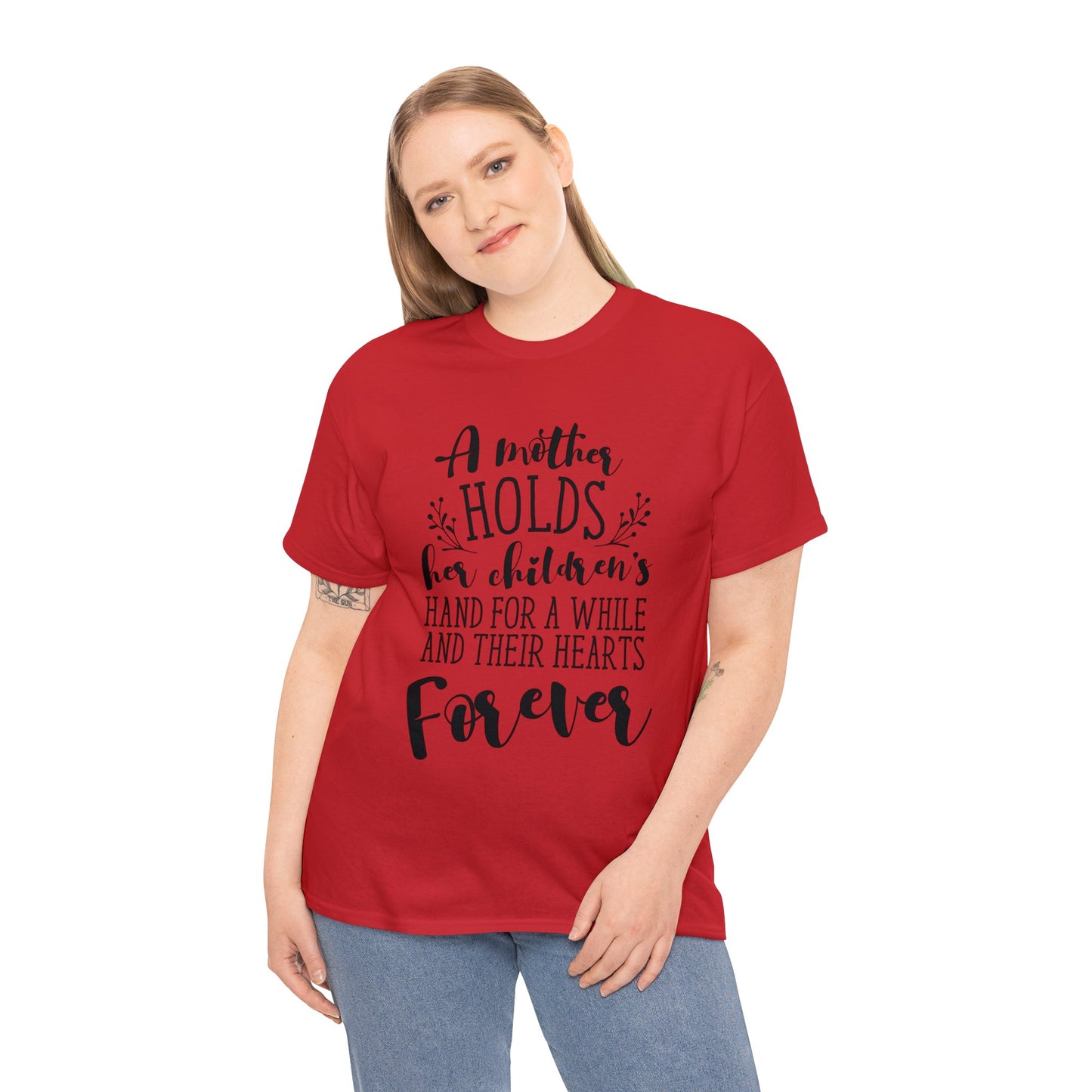 A mother holds her child's heart- Unisex Heavy Cotton Tee