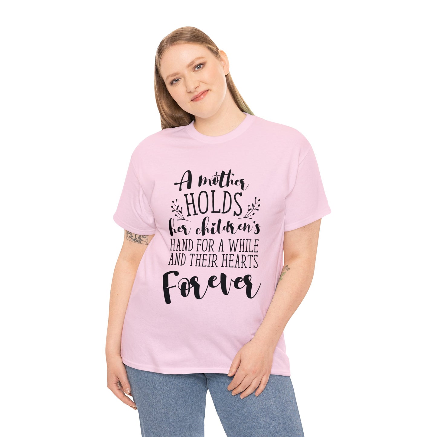 A mother holds her child's heart- Unisex Heavy Cotton Tee