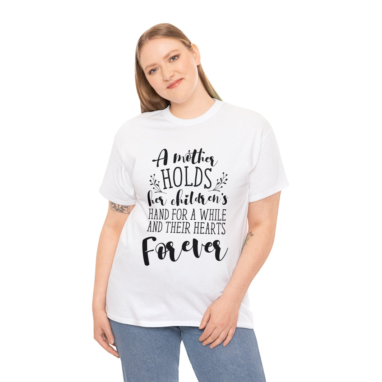 A mother holds her child's heart- Unisex Heavy Cotton Tee