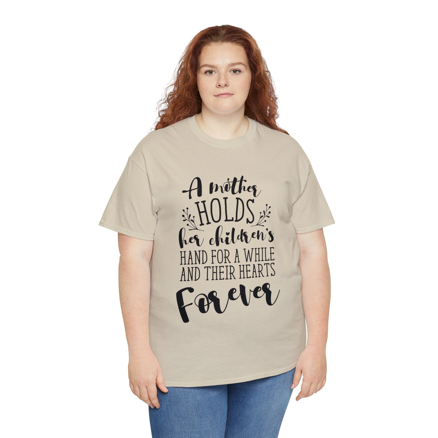 A mother holds her child's heart- Unisex Heavy Cotton Tee