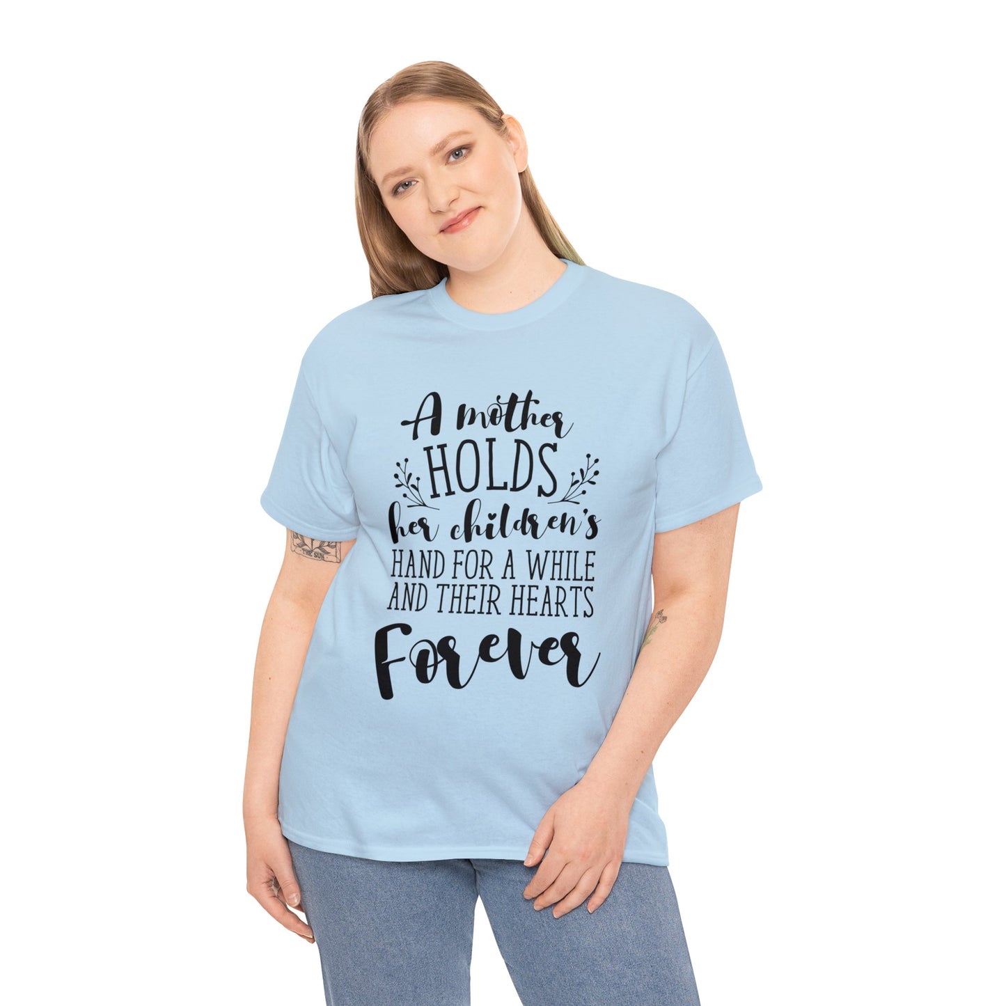 A mother holds her child's heart- Unisex Heavy Cotton Tee